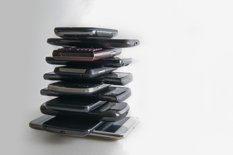 a stack of old mobile phones