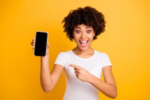 woman pointing at phone