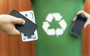 E waste ,disassembled smartphone and recycle bin