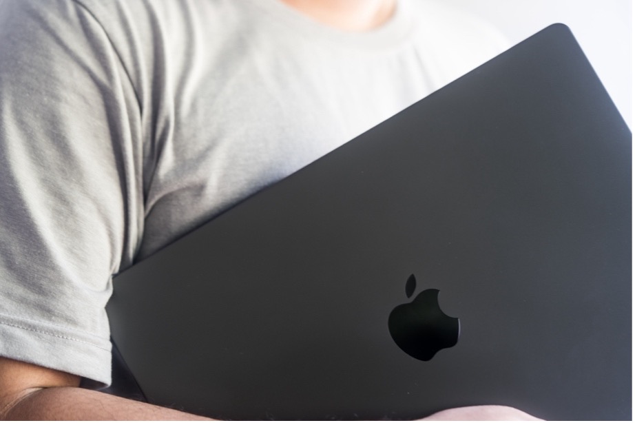 A person holding a computer