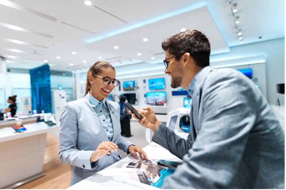 A person and person looking at a phone