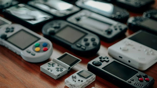 Lots of different consoles laying on a table