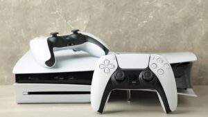 A Playstation and two white controllers