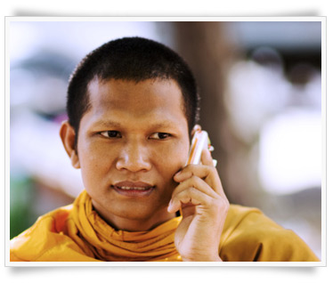 man using mobile phone in yellow clothing